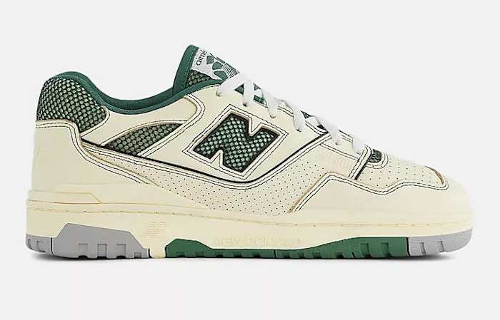 Side view of tan and green New Balance sneakers.